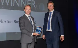 Norton Rose Fullbright's Matthew Gregory collects the Partner initiative trophy